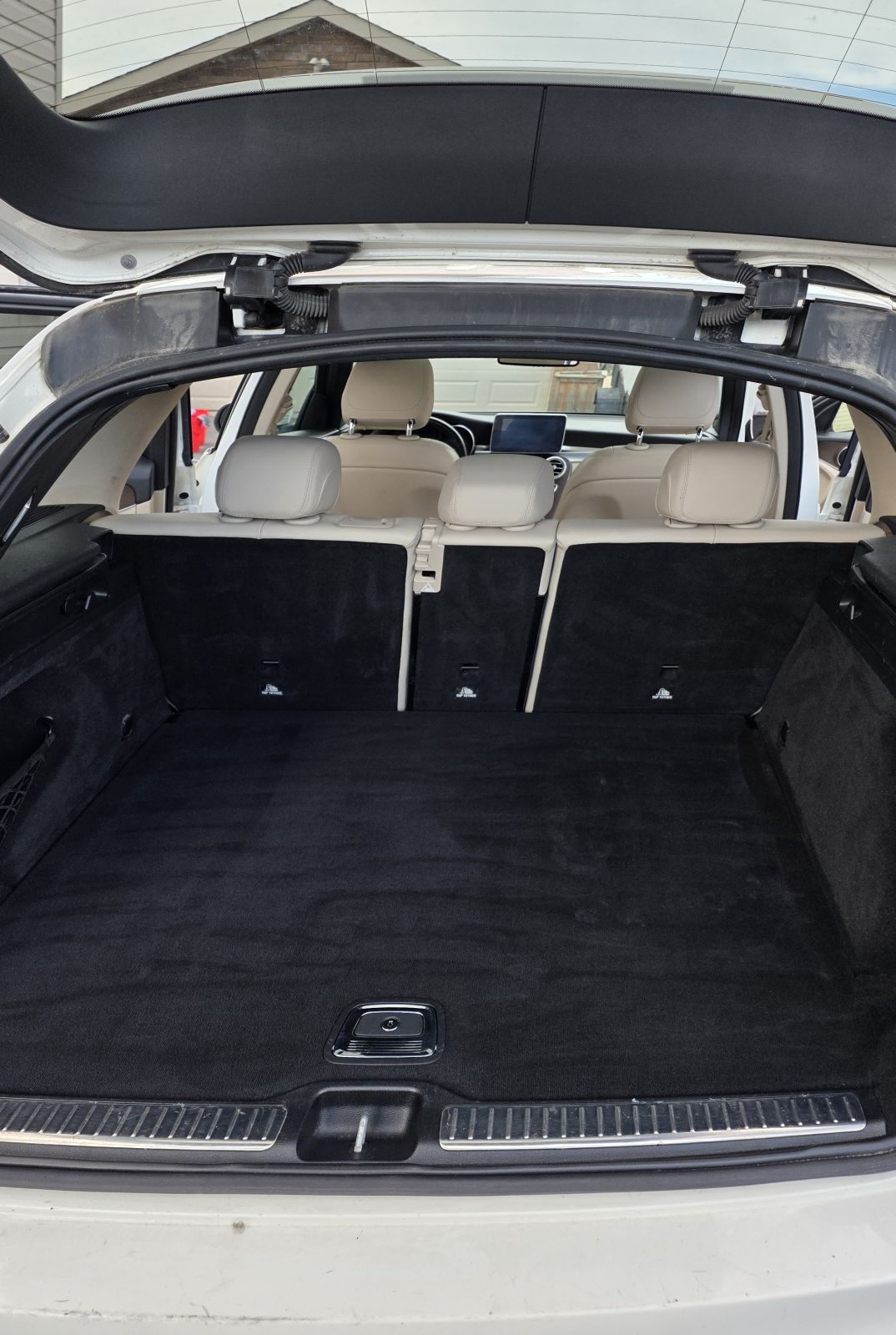 The same cargo area after detailing, carpet clean