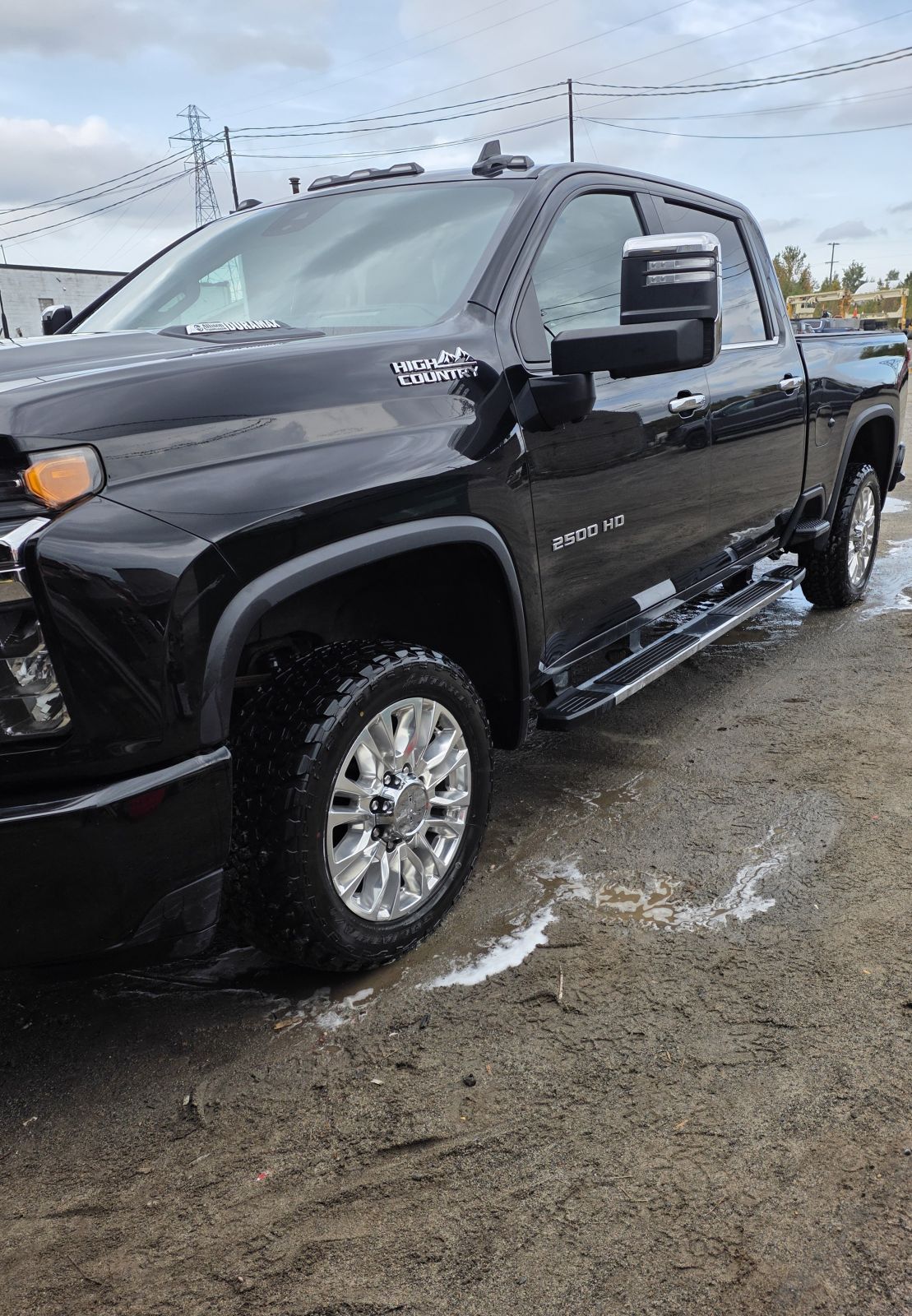 The same Silverado after detailing, paint and wheels clean and glossy