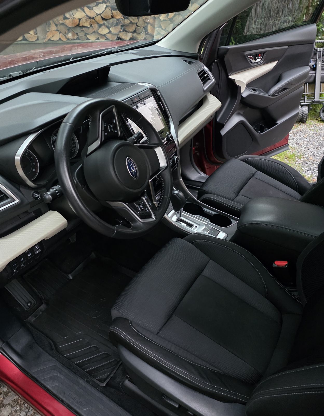 The same Subaru interior after detailing, mats and seats clean