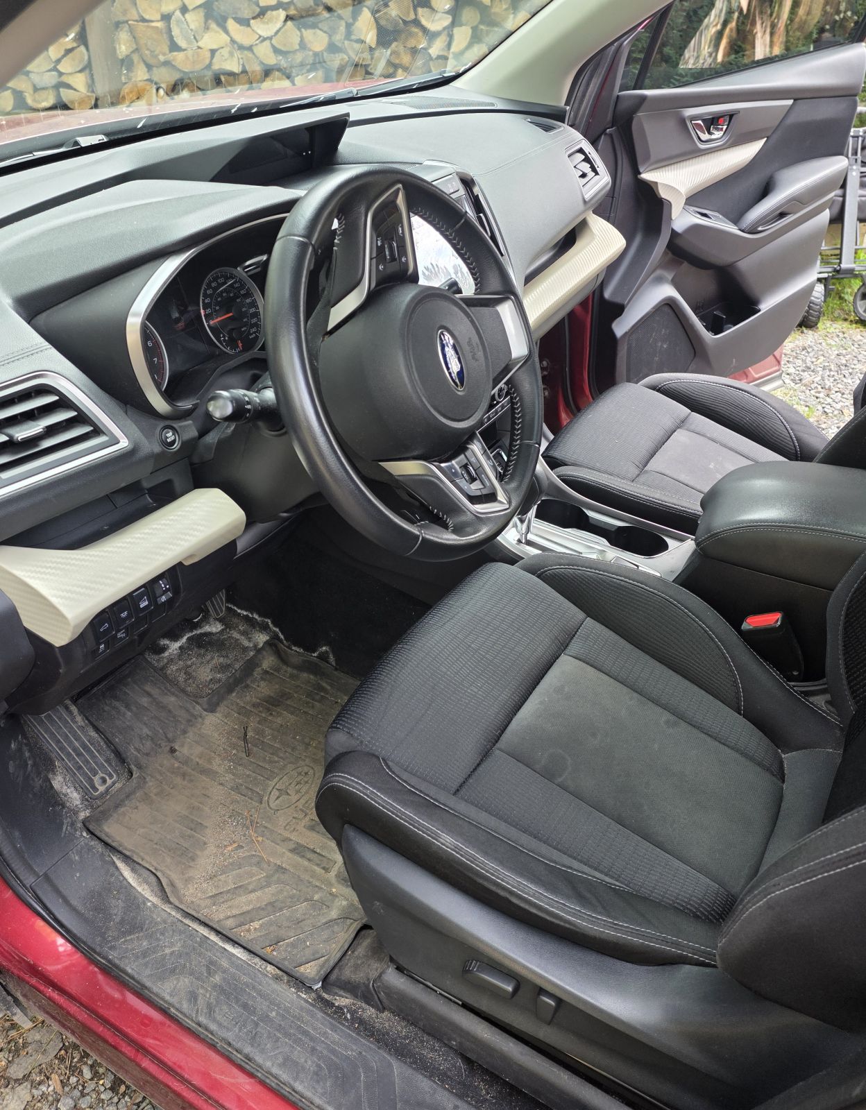 Subaru front interior before detailing, mats and carpet dirty